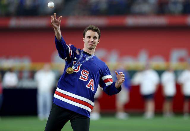 Dallas Stars goaltender and Olympic gold medalist Jake Oettinger throws the ceremonial first pitch before the start of the Texas Rangers’ home opener against the Cincinnati Reds on Friday, April 3, 2026, at Globe Life Field.